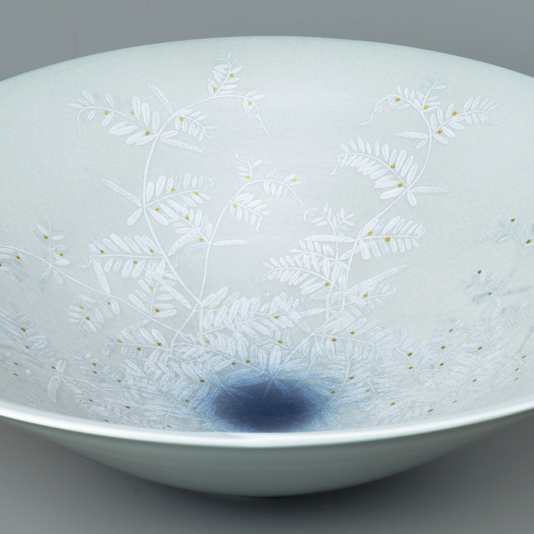 photo Bowl with grass design in silver and gold under aster glaze.